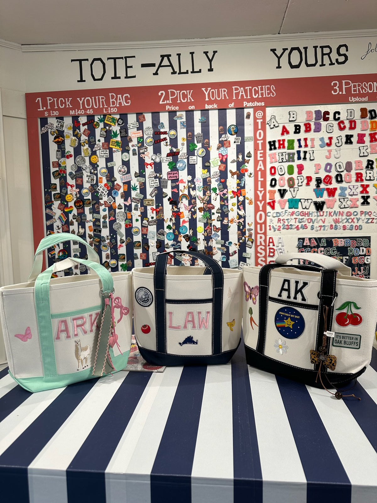 Custom totes and a patch wall at the Oak Bluffs studio