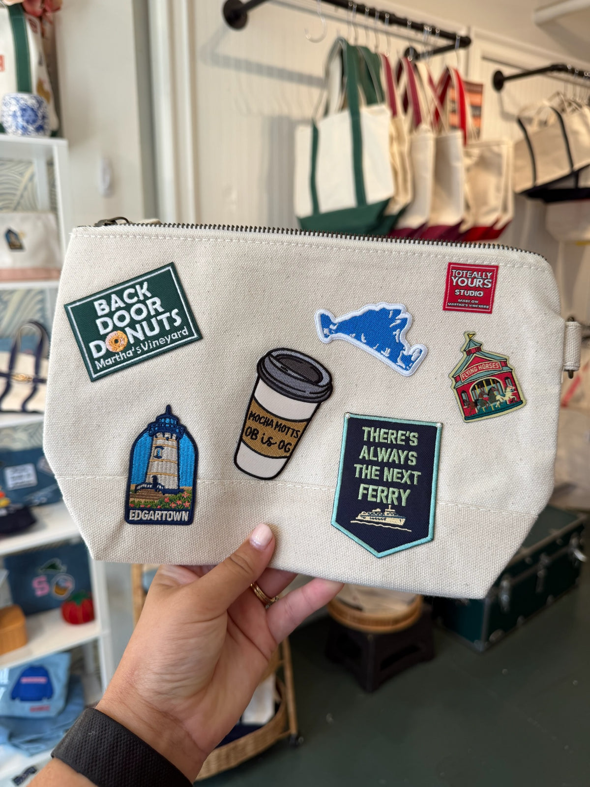 Canvas pouch with Edgartown, Back Door Donuts, and ferry patches